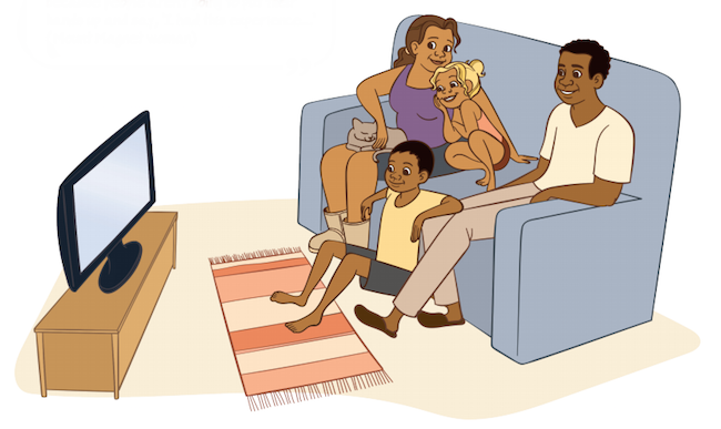 Family sitting on sofa watching TV together